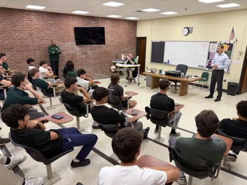 Former NFL All-Pro Patrick Kerney Visits with Holy Cross Football Team