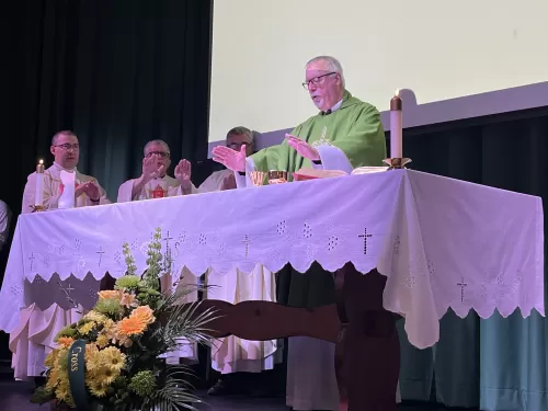 Archbishop Coyne Visits Holy Cross High School