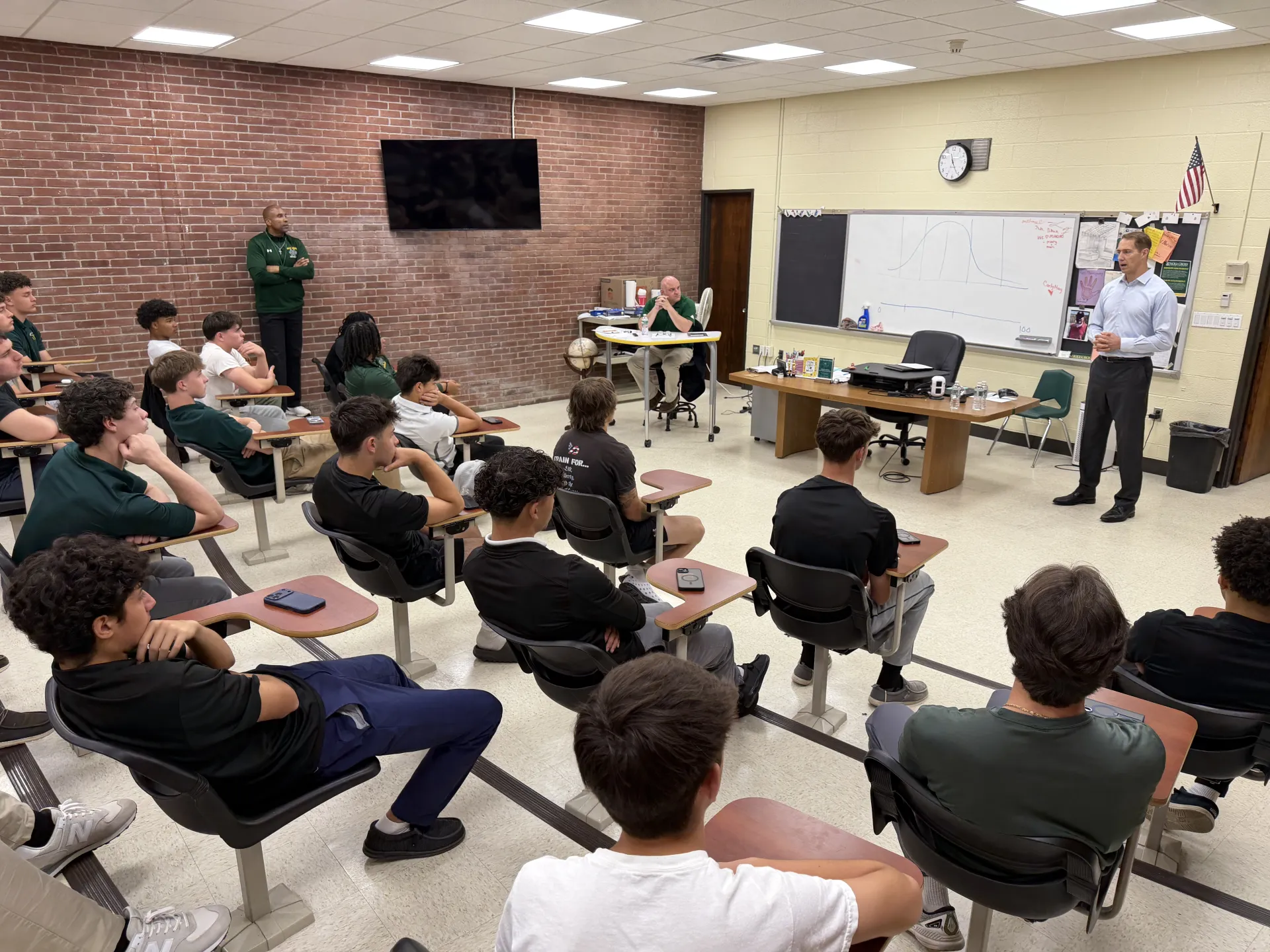 Former NFL All-Pro Patrick Kerney Visits with Holy Cross Football Team