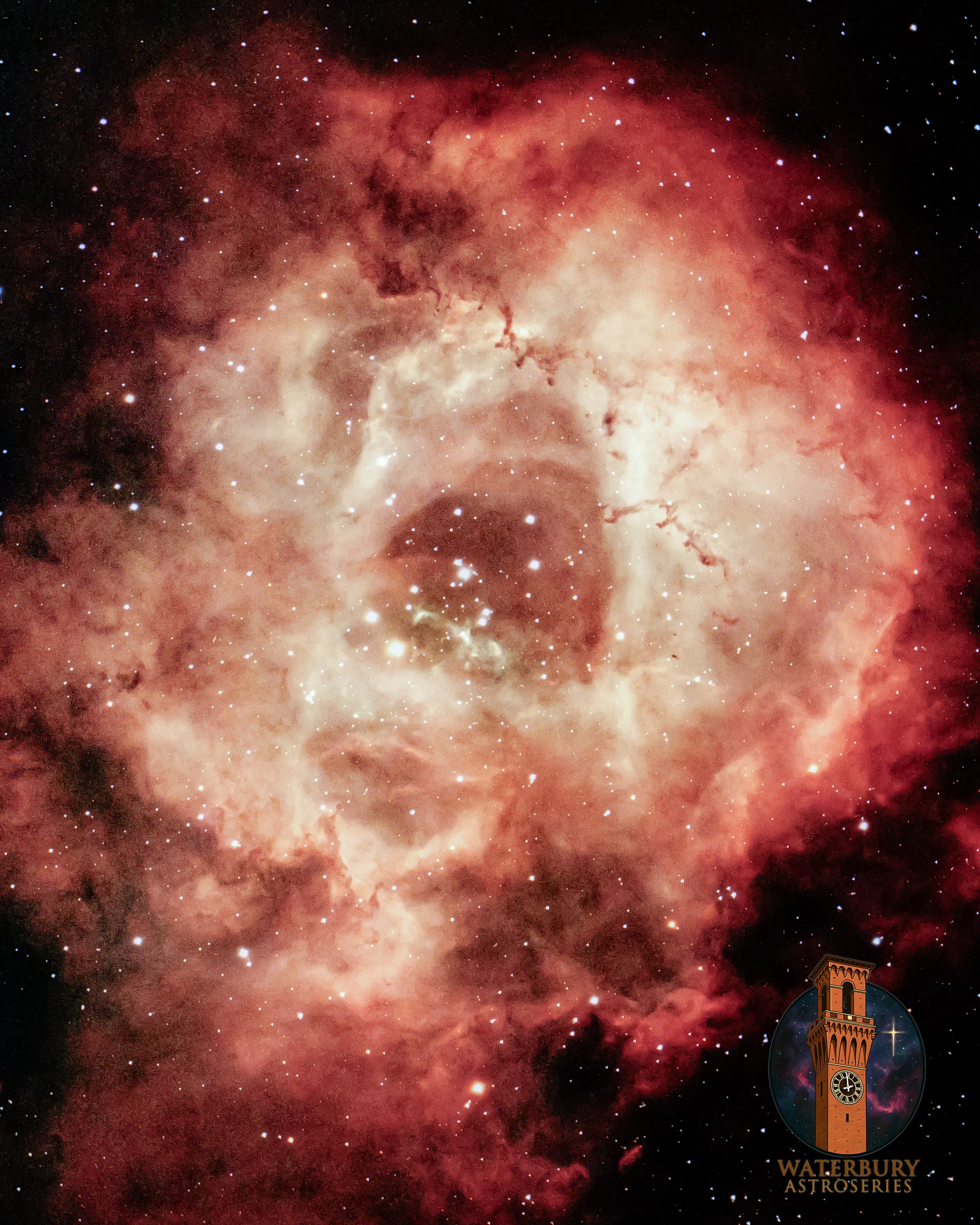 Figure 19 | The Rosette Nebula (NGC 2237). Photographed on Christmas Night, 12/25/2025, from Waterbury, CT as the "first light" for the Academy's new astrograph. The image was taken using a ZWO ASI585MC Pro one-shot color camera through the state-of-the-art Sky-Watcher HAC125dx (f/2 at 250 mm focal length, gain 200) on the Sky-Watcher EQ-AL55i mount (with extension pier) tracking the sky at sidereal rate. Light pollution was minimized with the Optolong L-Quad Enhance filter. The rig was run by the ZWO ASIAIR Plus and focus was automated by the ZWO EAF-N (attached with a kit from Starizona). Sky-tracking was done through the SVBONY SV165 40 mm Mini Guide Scope @ f/4 with a ZWO ASI220MM Mini mono camera. The twenty best 5-minute images were integrated within DeepSkyStacker for a total of 1h 40m of data; the output TIFF was then stretched in Adobe Photoshop CC v. 27.3.0 using the Astronomy Tools Action Set (v. 1.6.2 from ProDigital Software), AstroFlat Pro (v. 1.4.11 from ProDigital Software), and StarXTerminator (RC Astro). The mark in the bottom right is the logo of the Waterbury Astroseries, an initiative within the Science Academy at Holy Cross High School to bring the wonders of Waterbury's night sky back to our community and peers.