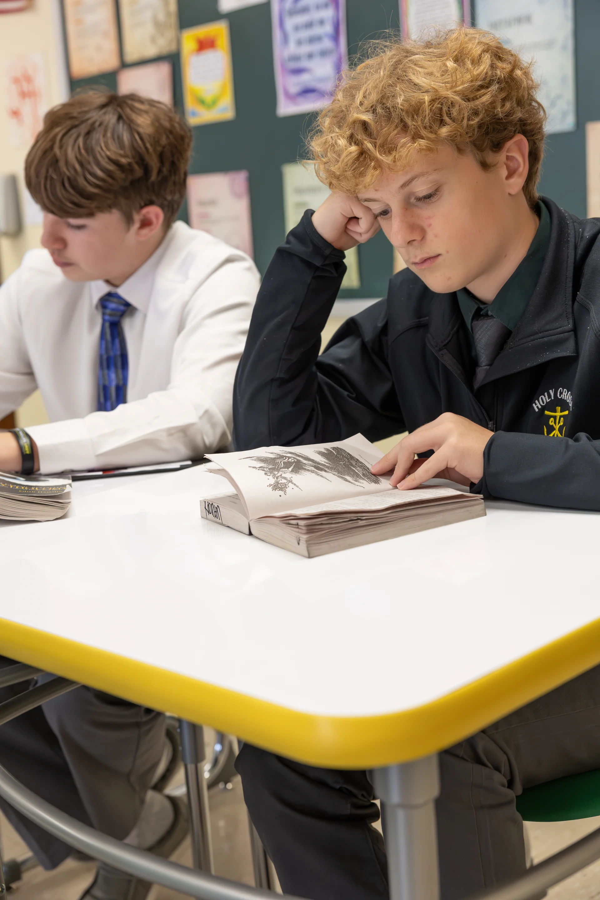 male student working at desk